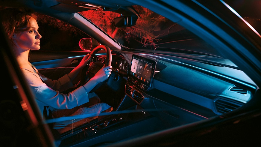 woman charging the new cupra formento -e-hybrid with the cupra wallbox