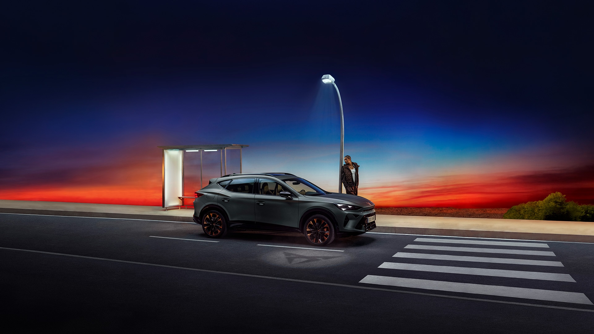 A three quarter front view of the new CUPRA Formentor 2024 car in motion, in the century bronze matt colour, with a blurred background.