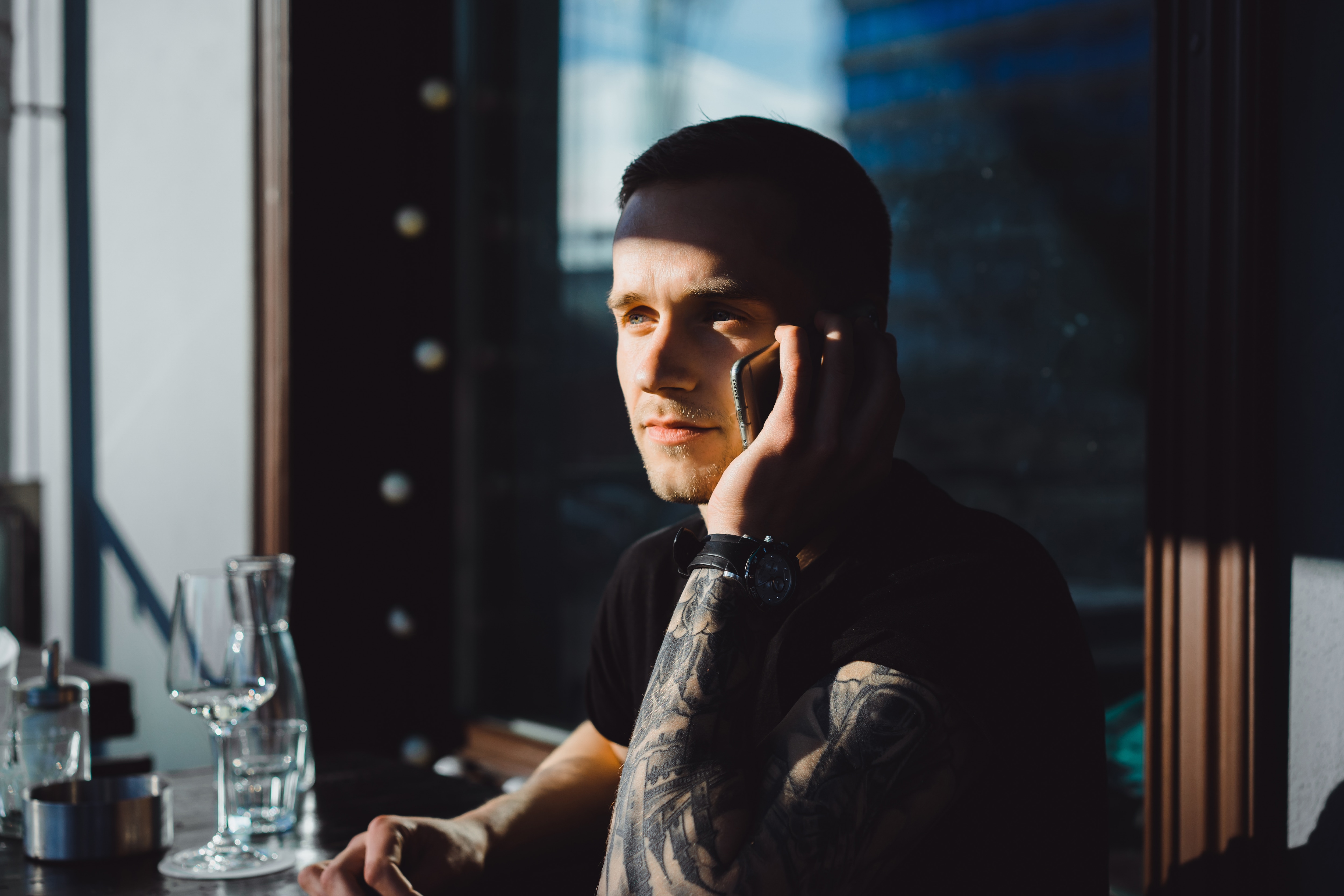 Man on phone at restaurant