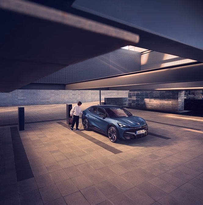 Person getting into Cupra Car in a garage 