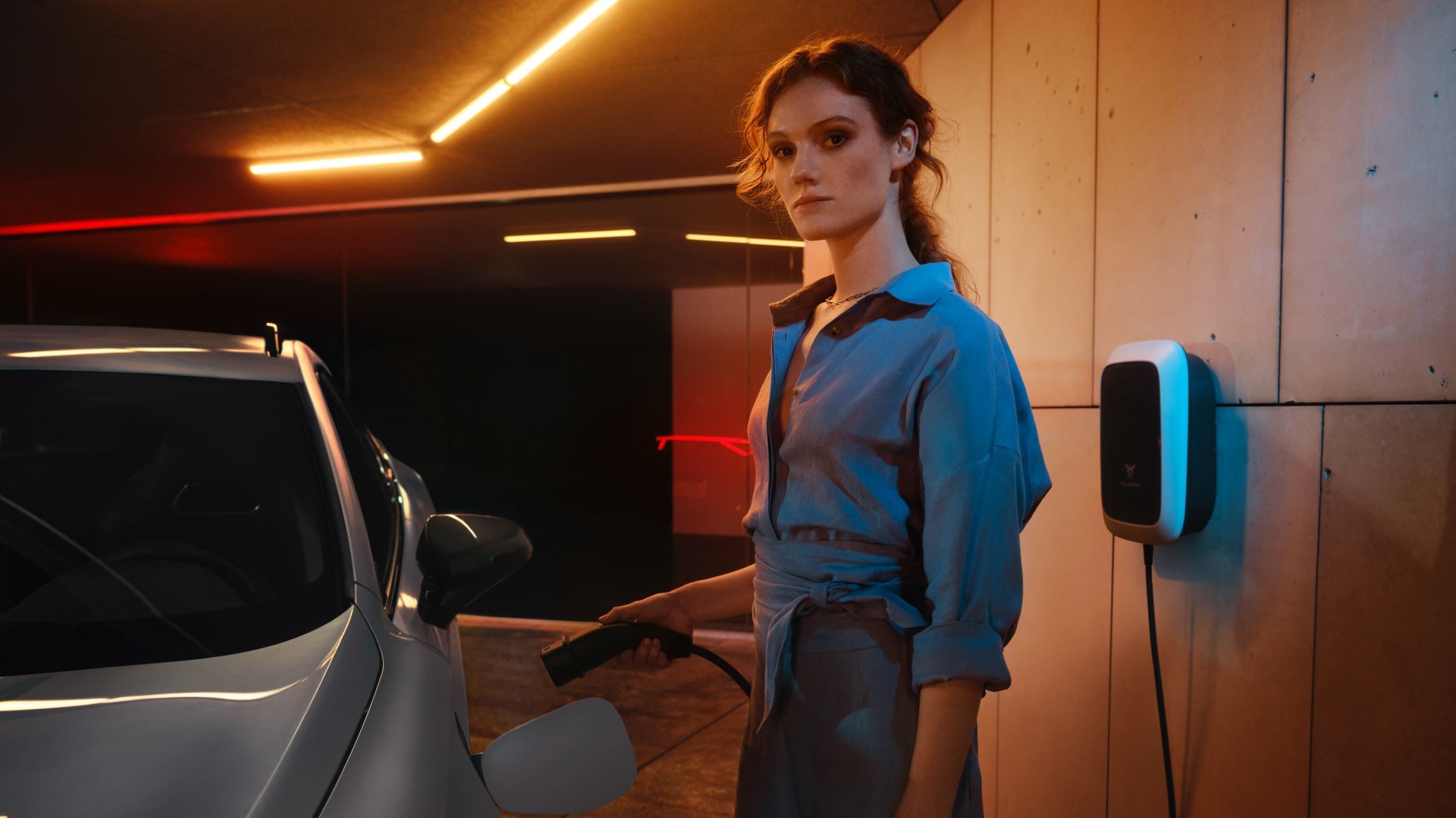 Woman charging cupra